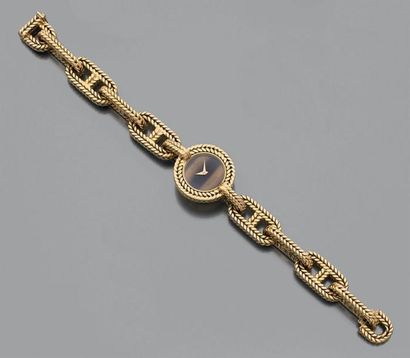 HERMES pour BAUME ET MERCIER Montre bracelet en or jaune 18k tressé composé de maillons...