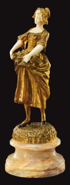 ALBERT SCHRODEL (XIX-XXème) Sculpture chryséléphantine en bronze doré et ivoire figurant...