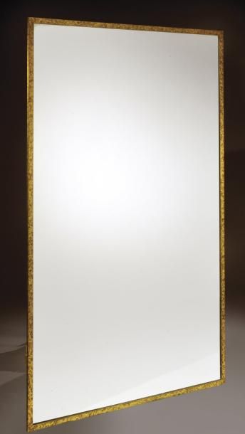 Eugène Printz (1879-1948) Important miroir à encadrement en laiton à patine oxydée...