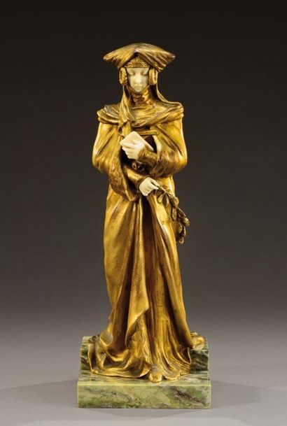 DESIRE GRISARD (Né en 1872) «Le secret» Sculpture chryséléphantine en bronze doré...