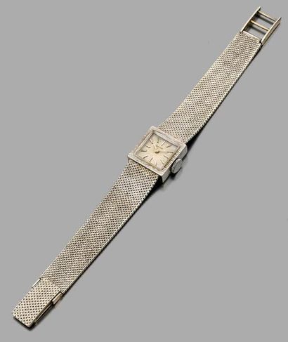 null Montre de dame en or gris 18K, bracelet souple, cadran carré. Long.: 15 à 16...