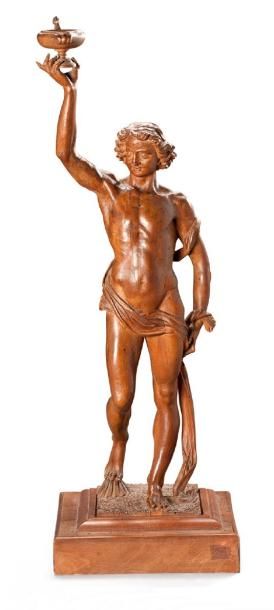 null Statuette en tilleul sculpté représentant un éphèbe tenant de son bras droit...