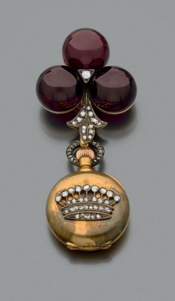 null Broche en or jaune 18k formant une chatelaine sertie de grenats et de diamants...