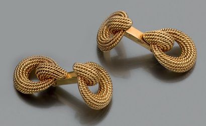 null Paire de boutons de manchettes "boucle" en or jaune 18k tressé. Vers 1950.

Pb.:...