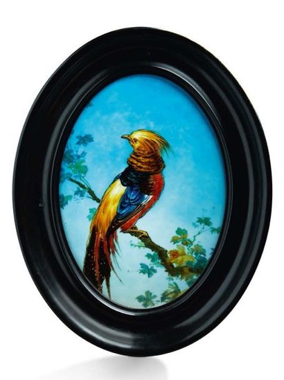 Théodore DECK (1823-1891) Plaque ovale en céramique émaillée à décor d'un oiseau...