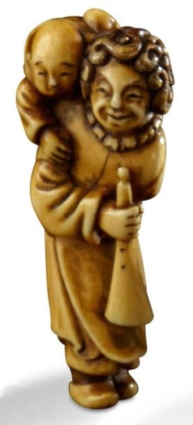 JAPON, XIXème siècle 
Netsuke figurant un portugais portant un enfant sur son dos....