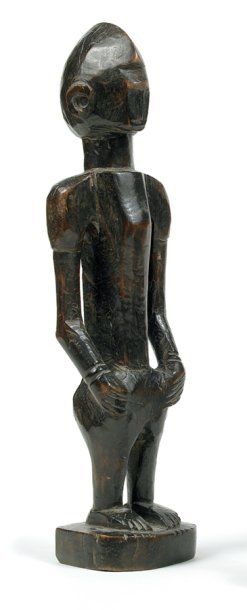 Bambara / Malinké. (Mali) Bois. H.: 31 cm Ancienne statuette anthropomorphe aux formes...