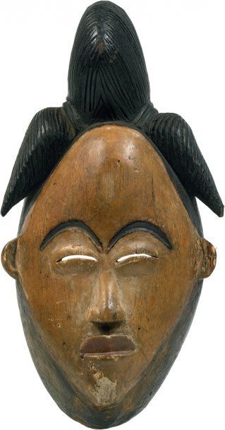 null Punu. (Gabon) Bois. H.: 28 cm Ancien masque au visage surmonté d'une classique...