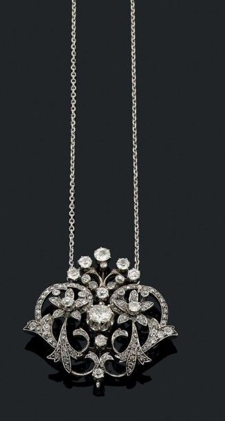 null Collier en or gris 18k (750) composé d'un pendentif «guirlande» orné de fleurettes...