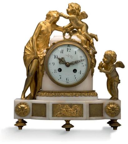 null Pendule en marbre blanc et bronze doré, représentant
Vénus jouant avec deux...