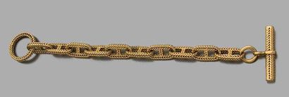 HERMES Bracelet "chaine d'ancre" en or jaune 18k (750) tressé.
Signé
Long.: 21.5cm
On...