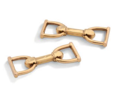 null PAIRE DE BOUTONS DE MANCHETTES "ÉTRIER" en or jaune 18K (750)
Pb: 10.64gr