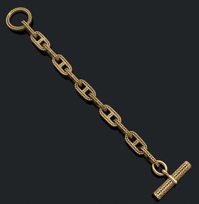 HERMES Bracelet "chaine d'ancre" en or jaune 18k (750) tressé.
Signé et numéroté.
Poinçon...