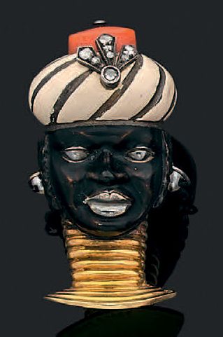 CARTIER Clip "tête de Maure" en or jaune 18k (750) émaillé noir et beige, le turban...