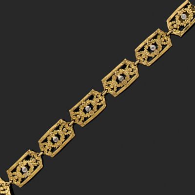 null Bracelet articulé en or jaune 18k (750) composé de sept maillons rectangulaires...