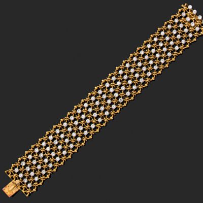 CARTIER Bracelet ruban composé d'une résille d'or jaune 18k (750) en fils torsadés...
