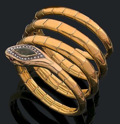 null Bracelet "serpent" articulé en or jaune 18k (750) serti sur la tête d'un péridot...