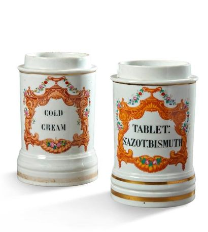 null Deux pots 

en porcelaine de Paris à décor de cartouches dorés su fond blanc...