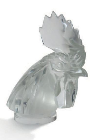 RENE LALIQUE (1860-1945) Bouchon de radiateur «Tête de coq» en verre blanc moulé-pressé
Signature...