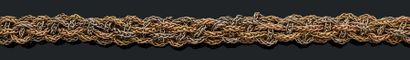 CHAUMET Bracelet souple en or jaune, rose et gris 18K (750) composé de chaines tressées.
Signé...