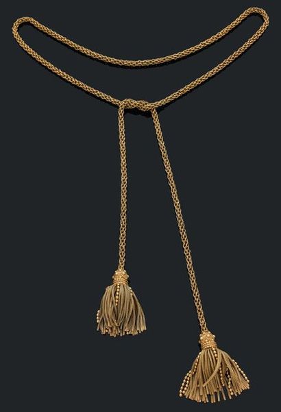 HERMES Sautoir en or jaune 18K (750) composé d'une grande chaine tressée ornée aux...