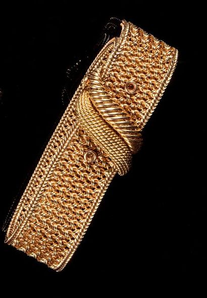 null Bracelet "ceinture" en or jaune 18k (750) tressé. Vers 1950

Longueur ajustable:...