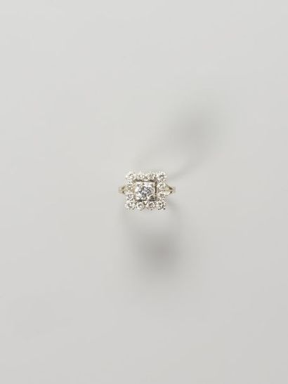 null Bague en or gris 18k (750) sertie d'un diamant de taille brillant dans un entourage...