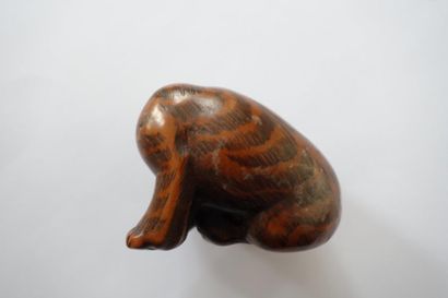 null Japon, période Edo, XIXe siècle

Netsuke en bois représentant un tigre assis,...