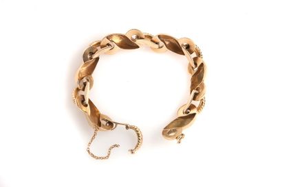 null Bracelet articulé en or jaune 18K (750) à motifs stylisés de "S". Travail français.
Long.:...