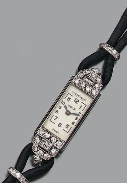 JAEGER-LECOULTRE Montre de dame rectangle "duoplan" en acier sertie de petits diamants.
Cadran...