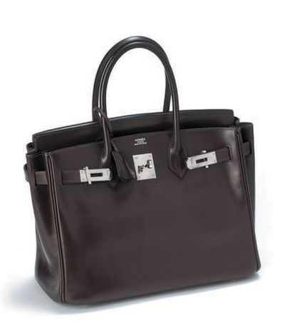 HERMES "Birkin 30" en cuir lisse marron, garniture métal argenté. Etat neuf.
Dans...