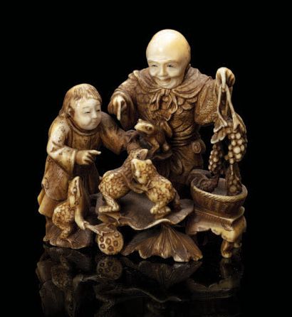 JAPON Petit okimono en ivoire teinté, représentant Gama-Sennin accompagné d'un enfant,...