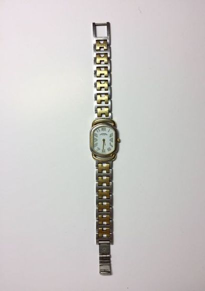 HERMES Arceau
Vers 1980. Montre dame 2 tons doré/acier.
Cadran blanc, chiffres arabes,...