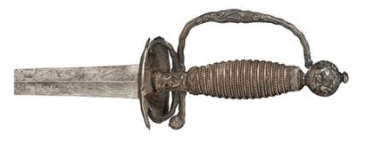 null Epée de cour, datée 1757.
Court sword with date 1757.
Monture en argent à coquille...