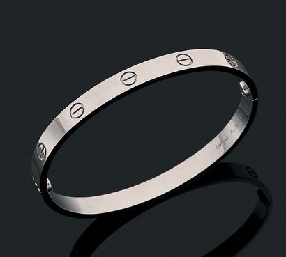 CARTIER "Love"
Bracelet or gris 18K (750). Signé.
Dans son écrin, deux tournevis...