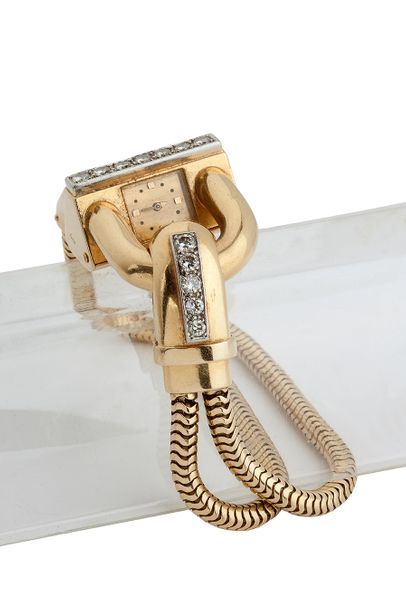 VAN CLEEF & ARPELS «Cadenas»
Bracelet - montre, diamants, chaine «serpent» or jaune...