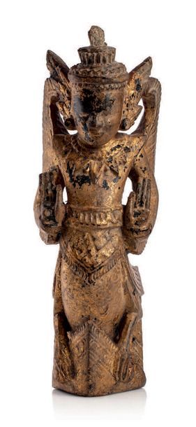 BIRMANIE XIXe SIÈCLE Statuette en bois laqué et doré, représentant un Kinari.
H....