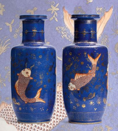 CHINE VERS 1920 
Pair of porcelain and powder blue enamel roller vases, decorated...