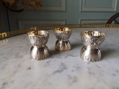 Set of three silver egg cups decorated with...