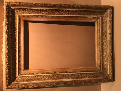 A gilded and carved wooden frame