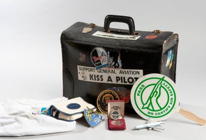 Leather suitcase including aviation-related...