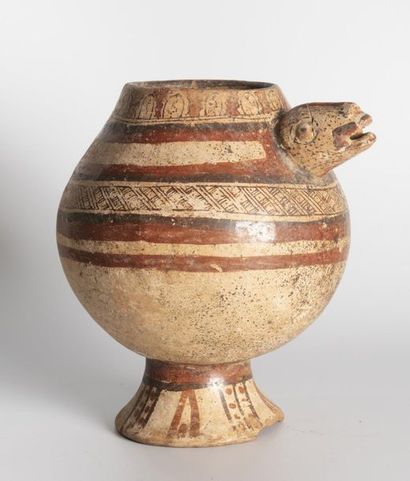  Vase on a pedestal decorated with a turtle head in relief 
The globular rumen is...