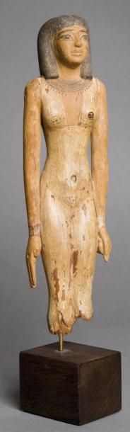 EGYPTE Statuette de jeune femme nue. La figurine est debout, la jambe gauche (en...