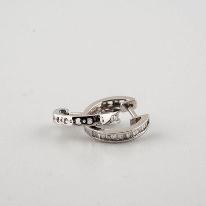 null Pair of 18K (750°/00) white gold hoop earrings set with baguette-cut diamonds....