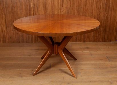 null Italian work, circa 1950

Round coffee table resting on four legs joined by...