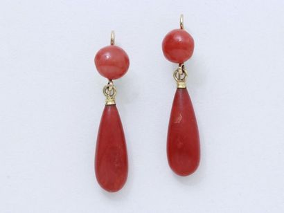  Pair of 750 thousandths gold earrings, holding a drop of coral in pendants, the...