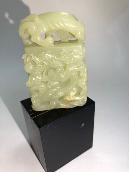Celadon jade pendant featuring a dragon....