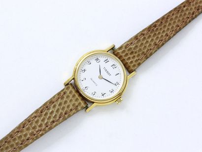  TISSOT 
Montre bracelet de dame en métal doré, cadran crème avec chiffres arabes...