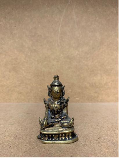 Petit Bouddha en tailleur 
Bronze 
6cm x...