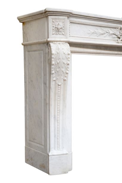  Louis XVI style mantel 
Arched lintel adorned with a median cartouche representing...